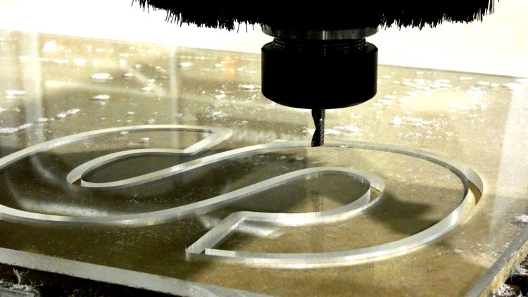 Acrylic letter 'S' being cut on a CNC Router