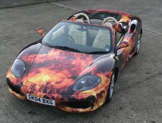 Black Porsche wrapped in vinyl flame effect graphics