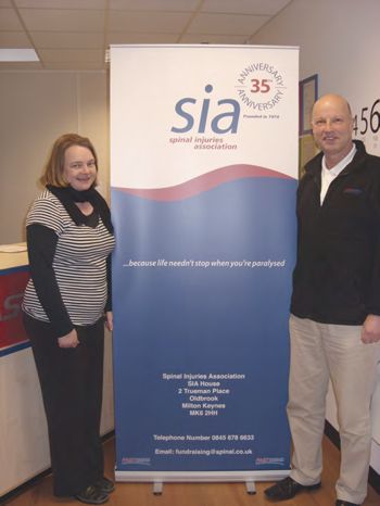 Elizabeth Wright and Alan Grimes with the SIA banner donated by Fastsigns Milton Keynes.