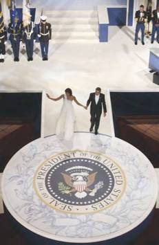 President and Mrs Obama walking on the custom-built circular stage