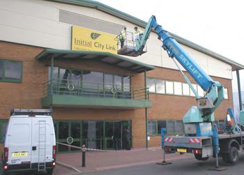 Illuminated flex face being installed by crane on lorry