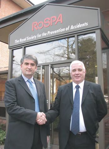 Tom Mullarkey, RoSPA Chief Executive and Bern Harrington, Sales and Marketing Director for Stocksigns, shaking hands.