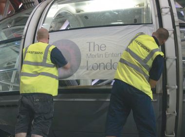 New graphics being fitted to a London Eye capsule by Fastsigns