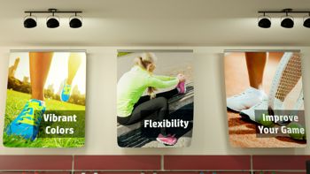 promotional pictures printed on fabric displayed on wall