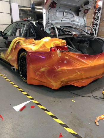Rear of a car being wrapped.