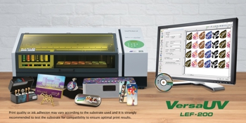 Roland printer with computer screen and accessories