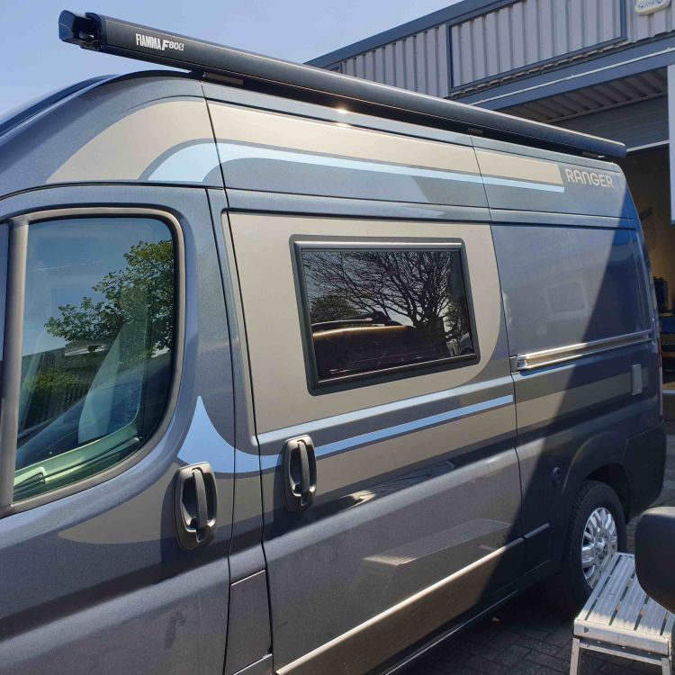 Camper van with vehicle graphics