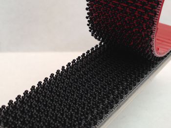 Two lengths of interlocking plastic being stuck together