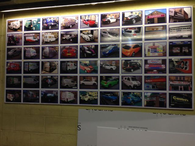 Wall with pictures from work dgSigns did