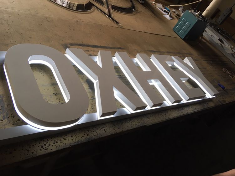 Built-Up letters mounted onto opal acrylic back trays to give halo illumination