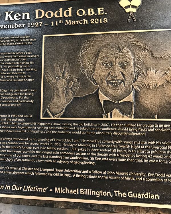 A chemically etched plaque with a picture of Ken Dodd