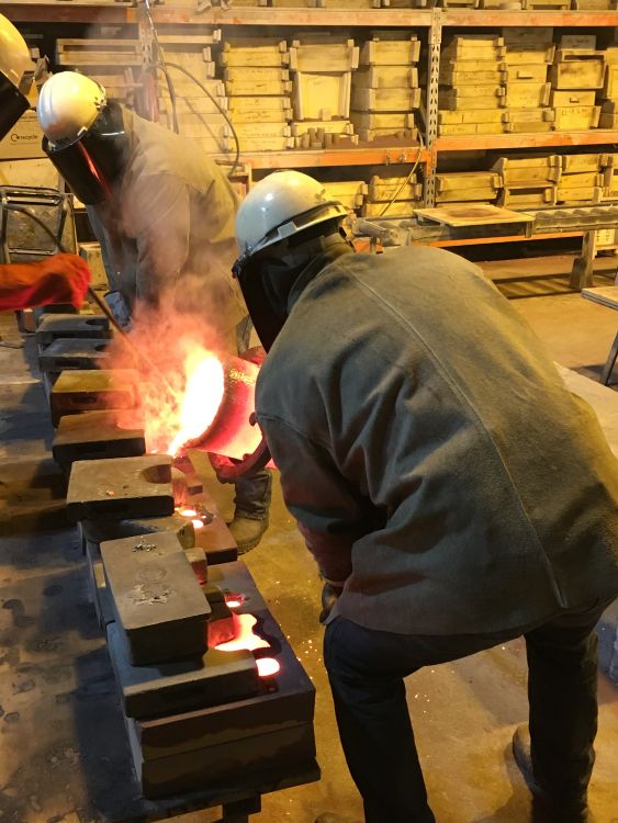 Men doing casting in a foundry