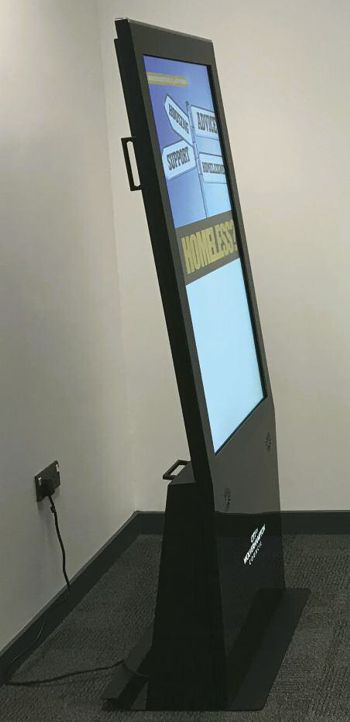 a one digital signage curved kiosk with the word homeless on it