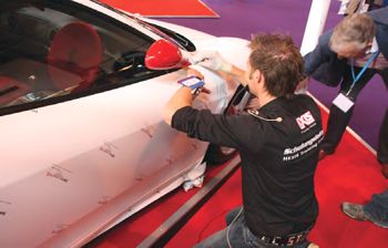 HX20000 cast vinyl being applied to door of a Ferrari