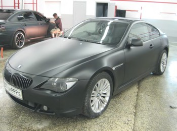 A BMW covered in matt black film from KPMF