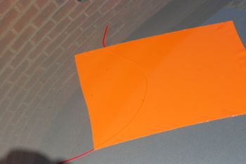 Wrapcut tape on a car bonnet with first layer of vinyl put over the top of it.