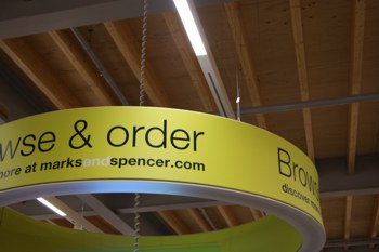 Gripple standard hanger suspending M&S retail signage
