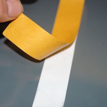 Removable UHB-351 tape having backing paper removed ready for adhesion.