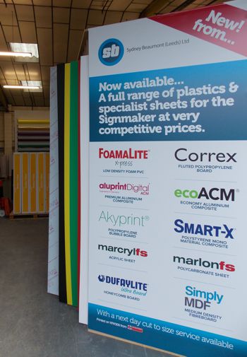 A row of flat sheet products stacked together