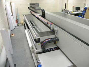 A close up of the Longier flatbed printer