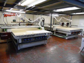 Two CNC routers in a workshop