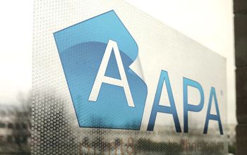 APA logo with dotty adhesive