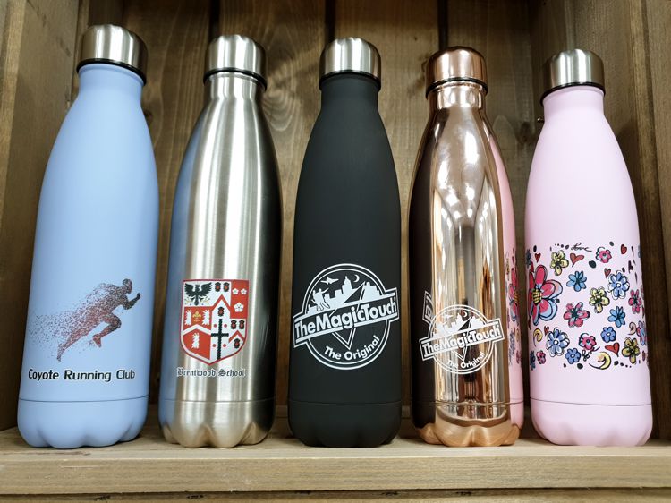 Bottles with full colour designs applied using a traditional mug press and the established CPM transfer paper