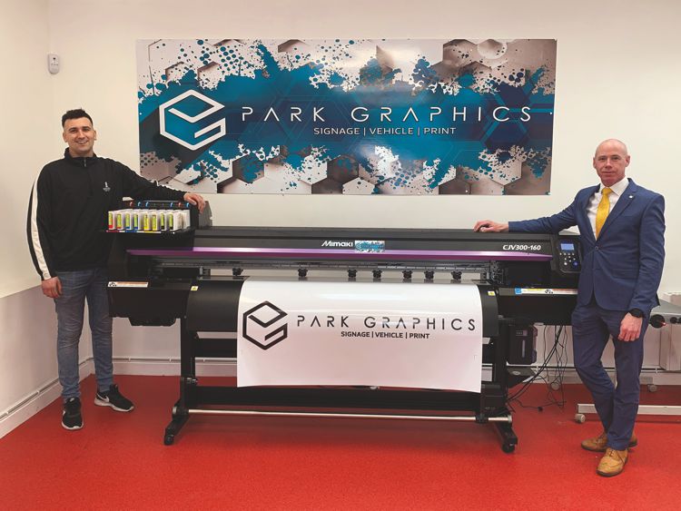 Park Graphics' Garry Walshe (left) with the Waterford-based business' new Mimaki CJV300 purchased through Bernard Hoey of GMPI (right) 
