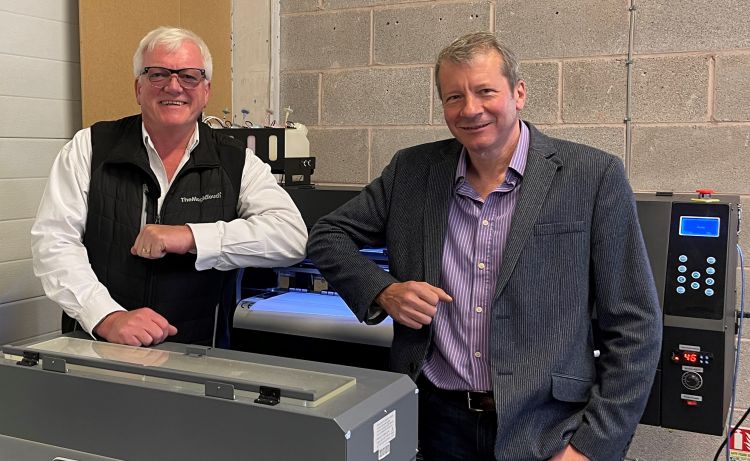 Jim Nicol from TheMagicTouch and Colin Marsh from Resolute DTG standing in front of the R-Jet Pro DTF printer