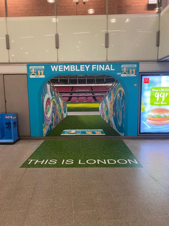 A graphic on a wall that makes it look like it's the entrance to wembley football stadium