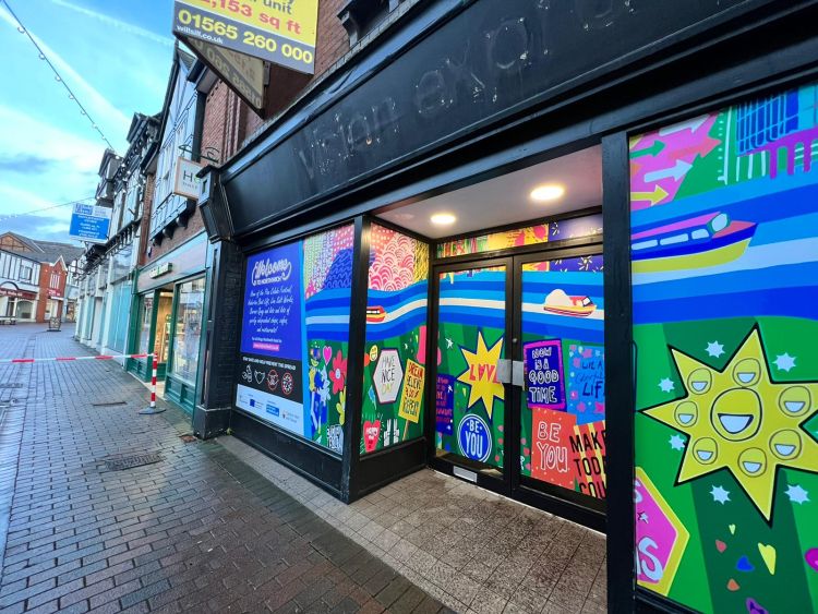 A vacant shop front decorated with Vinyl graphics in Northwich