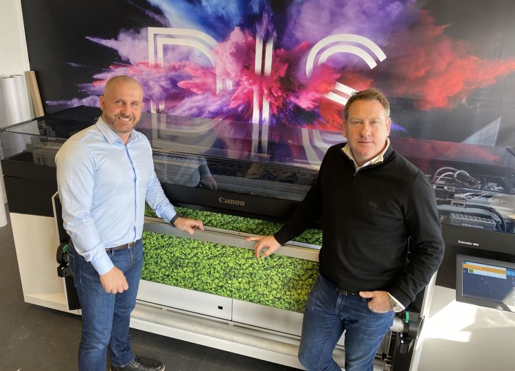 DIS Group Sales Director, Dave Purcell (Left) and Mark Bradley, DIS Group Managing Director, in front of their Canon Colorado 1650 UVgel printer.