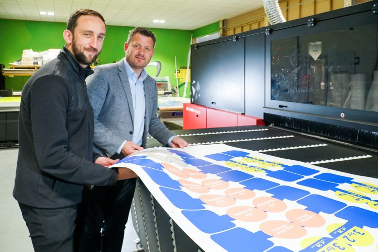 Andrew Gallagher Graphics Production Manager at Leading Edge Signs & Graphics with Paul Fitch from Agfa in front of the Agfa Tauro wide format printer