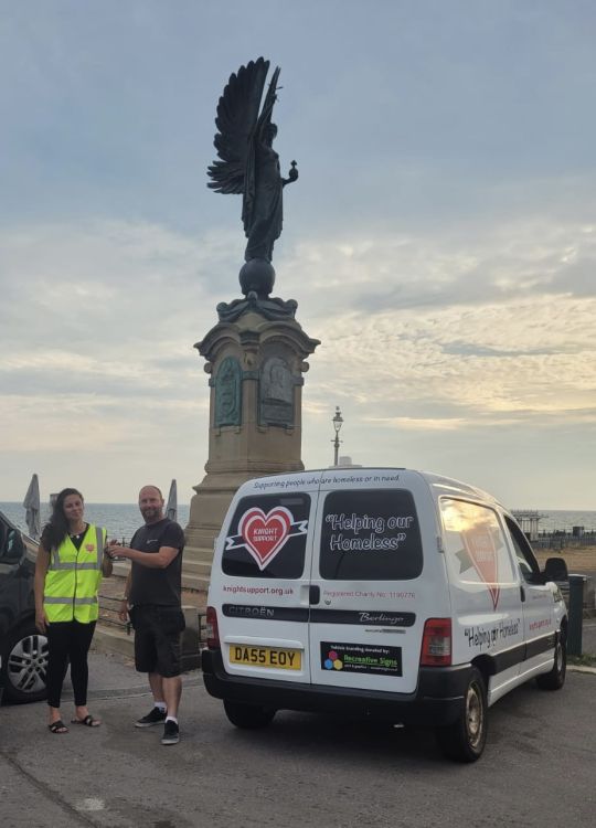 A van with vehicle graphics by the Angel in Hove