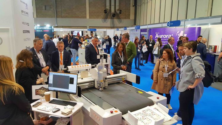 Lamination machine in action at an exhibition