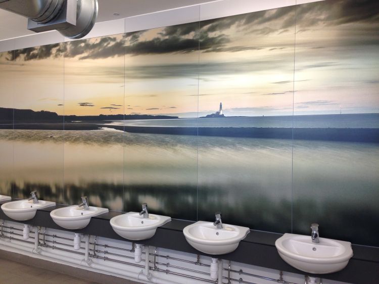 Anoprinted aluminium coastal image backdrop in public toilets.