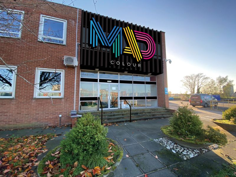 The front of Mad Colour workshop with a vivid sign above the front door
