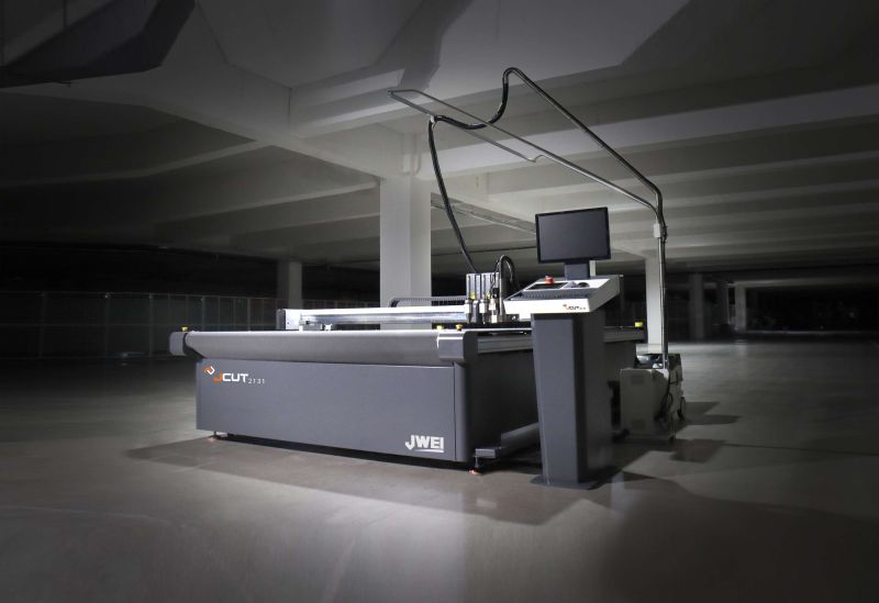 An image of the JWEI digital textile printer cutter inside an empty warehouse